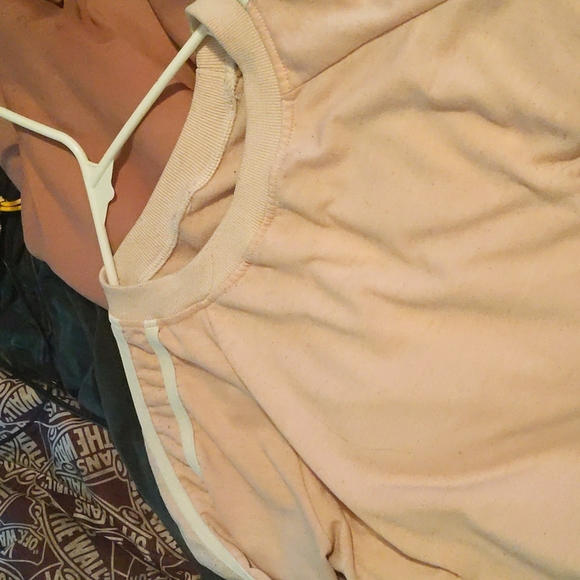A light pink crop top that has white stripes on it it's size medium - Picture 2 of 2